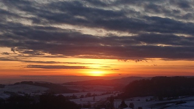 Bild: 2. Sonnenuntergang - Ausblick von Osterode in Richtung Niedersachswerfen. Die Sonne geht unter
