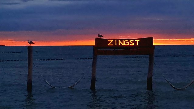 Bild: Zingst - wischen Himmel und Meer am Strand.
